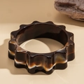 Macro shot of wavy resin bangle with amber marble texture on warm background - Wave Pattern Dark Tortoiseshell / Dark Coffee