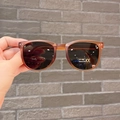 Detail of vintage reddish-brown kids sunglasses with UV400 grey lenses and CE mark - Orange