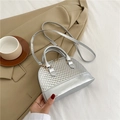 Silver shell-shaped handbag with woven texture and gold-tone hardware detail - Silver