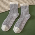 Detail of coral fleece slipper socks featuring non-slip grippers and soft gray-white design - One Size / Spliced Light Grey