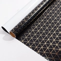 Black gift wrapping paper with gold geometric triangle pattern for elegant packaging - Black and Gold Triangle