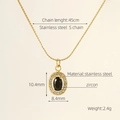 Golden stainless steel oval necklace featuring a black zircon stone and S-chain detail - Ellipse / Black