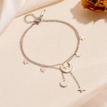 Close-up of dual-layer stainless steel anklet with gold star and shell moon charms - 21+5cm / Star Moon Tassel Anklet (P110) / Steel