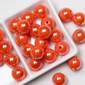 Macro view of iridescent orange acrylic beads for DIY bracelets and phone chains - Orange Red