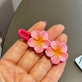 Pink frangipani flower hair clip with a yellow gradient finish and rose red metal base - Rose Pink Plumeria