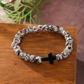 Handmade beaded bracelet with turquoise spotted stones and a black cross charm pendant - White Red Green Spotted Black Cross
