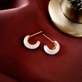 Detail of C-shaped earrings with white enamel and sparkling zircons on red silk - White Enamel C-Shaped (Gold Rim)