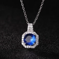 Macro detail of hexagonal pendant with blue gemstone and white zircon crystal accents - Sapphire Blue Zirconia Pendant Only (Without Chain)