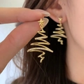 Gold-plated star Christmas tree earrings with pavé zircons worn on ear for scale - Gold Plated Copper / 925 Silver Pin / Gold