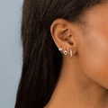 Golden Evil Eye earring set with blue zircon and pavé crystals on a female model - Evil Eye Earring Set B-TZ00360 Gold