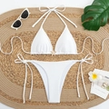 White halter bikini set with starfish detail on a woven mat with summer accessories - White