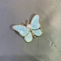 Elegant butterfly brooch in light blue with gold edges and central pearl accent - Single Item / Blue