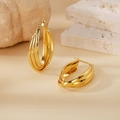 Detailed view of 316L gold triple hoop earrings with a polished finish and pin closure - 30mm (PJER234) / Gold