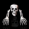 Realistic Halloween skull and hands stakes set with aged finish on black reflective surface - Three-Piece Set