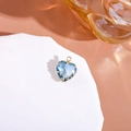 Blue gradient heart-shaped crystal pendant with gold-plated setting on white marble stone - Blue + White