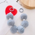 Detailed view of grey plush pompom balls and pearl beads chain for phone or bag charm - Light Gray