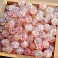 Detailed close-up of pink and red gold-foil glass beads for DIY jewelry making in a tray - M52# Peach Pink [10MM Water Dyed]