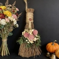 Handmade decorative holiday broom with pink dried flowers and rustic branch handle - Broom+Flowers+Strawberry Quartz