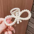 Elegant large bow hair claw clip featuring lustrous white pearls and gold spring - Figure-8 Hollow