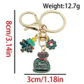 Christmas keychain with enamel pendants featuring tree and wreath with size specs - ER1797-Gift Bag Tree Bow Wreath 8-shape Keychain