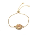Detailed view of adjustable gold evil eye bracelet with red zircon and colorful stones - Gold Box Chain Style