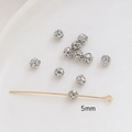 Detailed view of 5mm hollow gold-plated spherical beads for DIY jewelry making - 5mm / White Gold