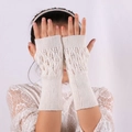 Chic cream white knitted fingerless gloves featuring elegant leaf-shaped hollow patterns - White