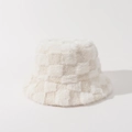 Detailed macro view of the soft plush texture and checkerboard pattern on a white bucket hat - One Size / Off White