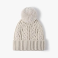 Creamy white cable knit beanie for women with a fluffy faux fur pom and ribbed cuff - One Size / Beige