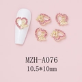 Macro detail of heart-shaped nail art charm with pink crystal and golden bow design - Golden Butterfly Heart Style (A076)