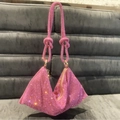 Detailed close-up of pink rhinestone handbag with knotted handle and sparkling crystals - Standard Size / Pink Zirconia