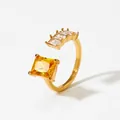 Adjustable gold plated ring featuring a large yellow zircon and four small clear stones - Gold + Yellow Zircon (KBJ465)