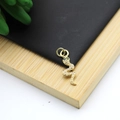 Gold plated snake pendant featuring micro-set white zircon and green gemstone eyes - Micro-pave Green Eye Snake Style