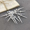 White plastic cake topper base stakes for birthday party decoration on grey surface - Long Handle Cake Wreath Base