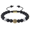 Macro shot of tiger eye stone beads and gold zircon sphere on adjustable braided bracelet - White Crystal Style