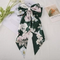 Elegant dark green floral satin bow hair clip on a minimalist aesthetic background - Green Flower
