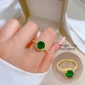 Detail of gold zircon ring with green gemstone showing 18mm size and 3.2g weight - Adjustable Open / Green Zirconia