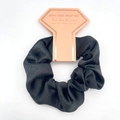 Elegant black satin hair scrunchie on a pink diamond-shaped card for wedding party gift - Black