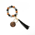 Detail of leopard print wood beads, black tassel, and MAMA engraved charm on keychain - Black