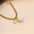 Elegant gold Cuban chain necklace featuring a white baroque pearl and golden letter pendant - Letter N Necklace