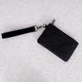 Black washed canvas coin purse with zipper closure and wrist strap on white background - Black