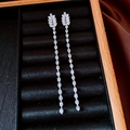Detailed view of silver-finish leaf tassel earrings with sparkling zircon on black velvet - Silver Needle - Silver Real Gold Plating