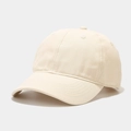 Detailed macro view of the cream cotton twill fabric and stitching on a baseball cap - Adjustable / Beige