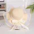 Detail of summer straw sun hat with wide wavy brim and printed bowknot ribbon - Mesh Edge Beige