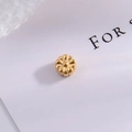 Macro shot of gold floral jewelry bead with daisy texture and polished metallic finish - Type F - Five-Petal Frosted Flower