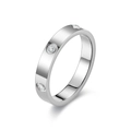 Macro shot of silver titanium ring with three bezel-set round sparkling cubic zirconia - US 5 / Full Rhinestone Style / Silver