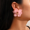 Pink frosted acrylic flower earrings with golden center shown on female model - Light Pink