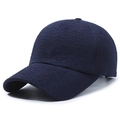 Navy blue baseball cap featuring unique pleated texture and a minimalist six-panel design - Blue