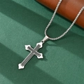 Detail of silver cross pendant with black inlay and box chain on textured green surface - Black Inlay Cross Pendant