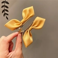 Pair of ginger yellow satin bow hair clips for girls featuring a polished silk finish - Ginger Yellow Satin Bow Pair